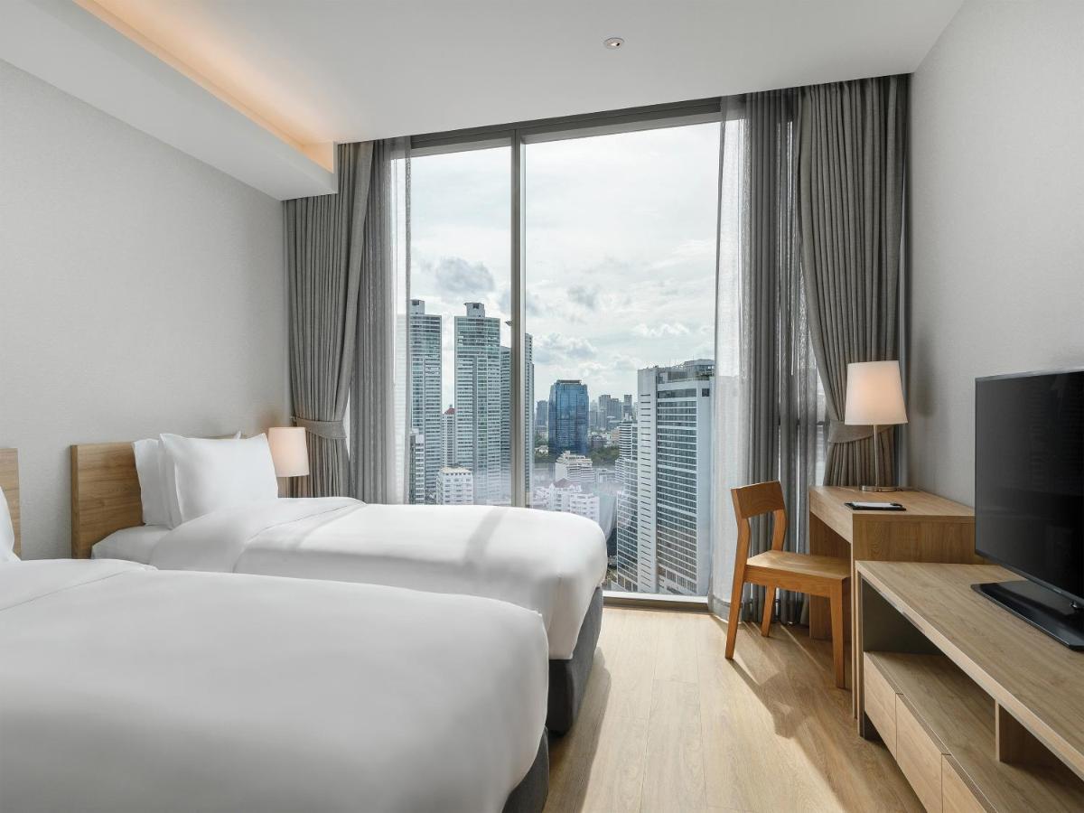 Oakwood Suites Bangkok Dış mekan fotoğraf Deluxe Room