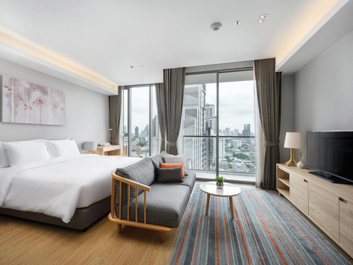 Oakwood Suites Bangkok Dış mekan fotoğraf Deluxe Room