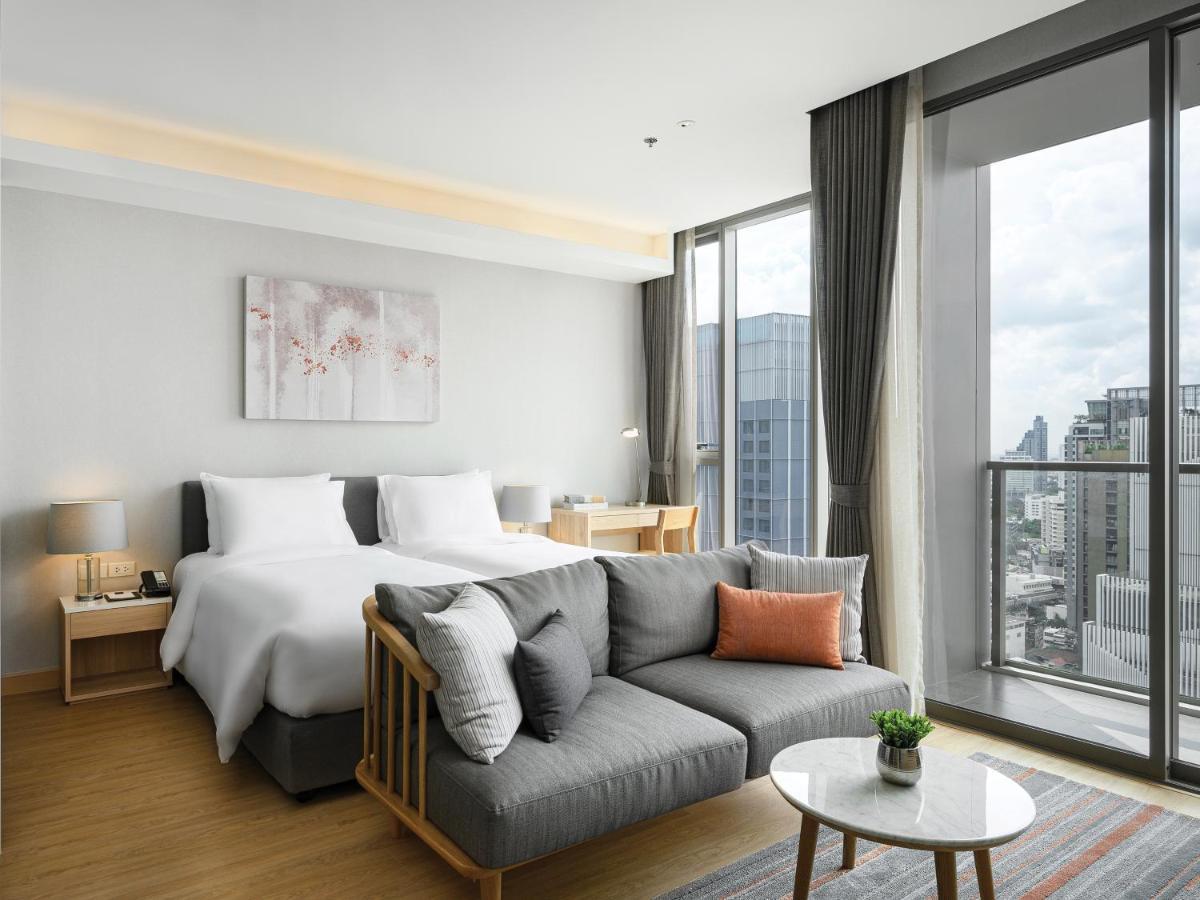 Oakwood Suites Bangkok Dış mekan fotoğraf Deluxe Room
