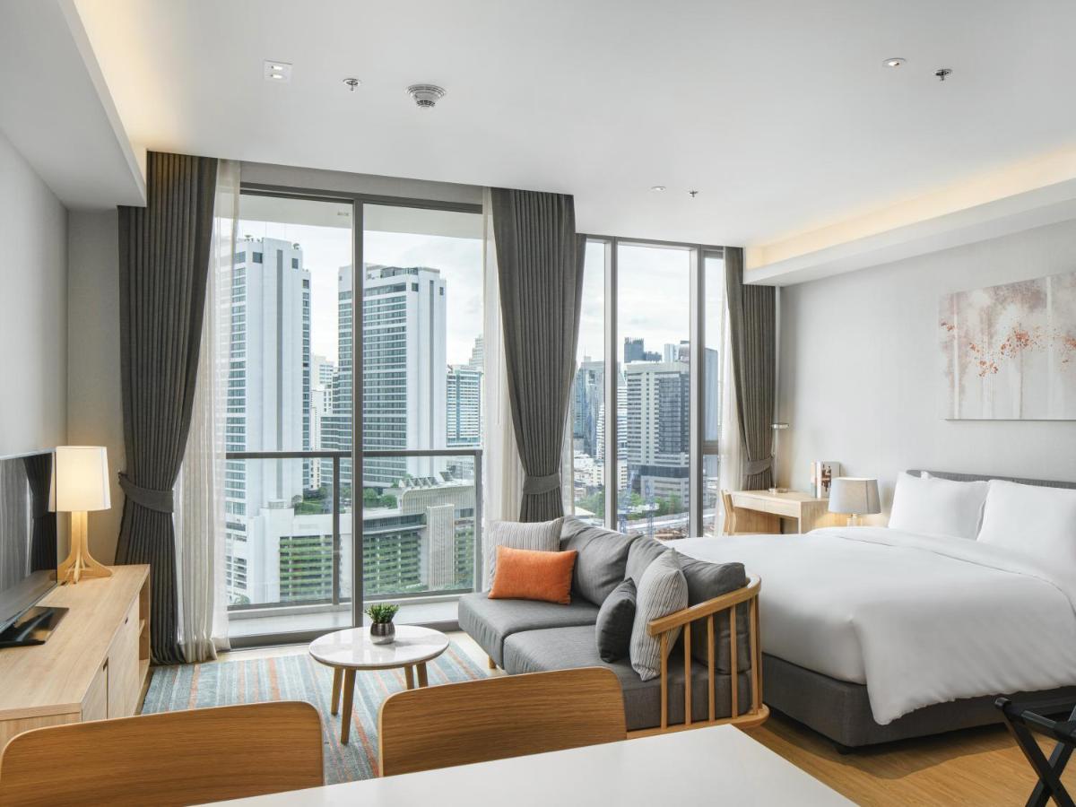 Oakwood Suites Bangkok Dış mekan fotoğraf Deluxe Room